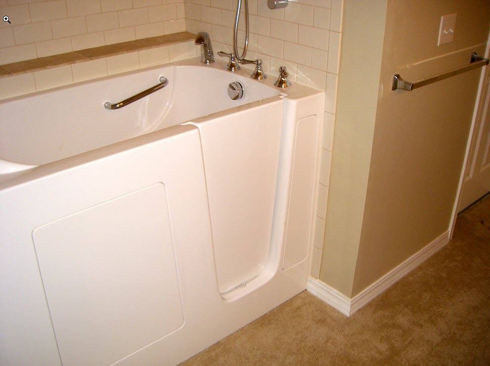 Walk in tub installed in a residential bathroom Walk in tub installed in a residential bathroom